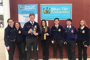 FFA students smiling as group with ribbons